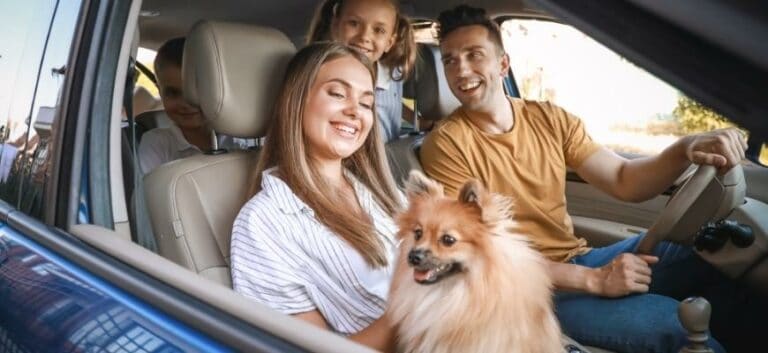 Happy Family with dog on a travel