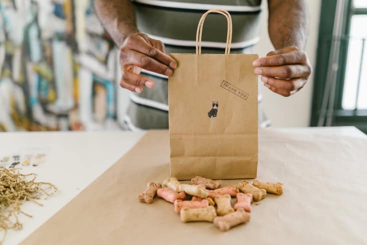 Man Holding Brown Paper Bag