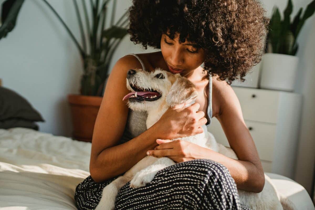 woman hugging her dog